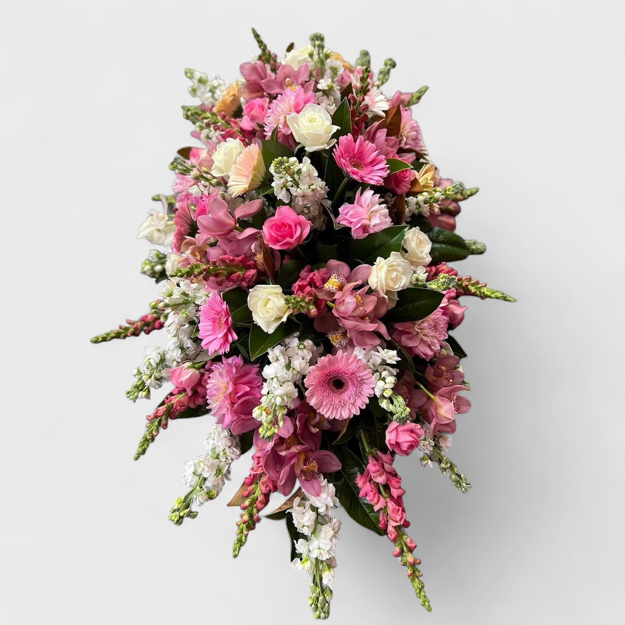 Juliette casket spray with pink roses – Auckland funeral flowers by Tomuri & Co.