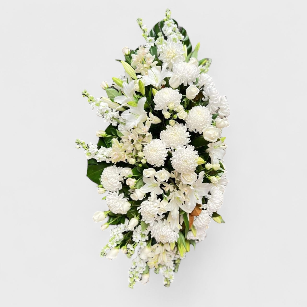 White lily and chrysanthemum casket spray – Auckland funeral flowers by Tomuri & Co.