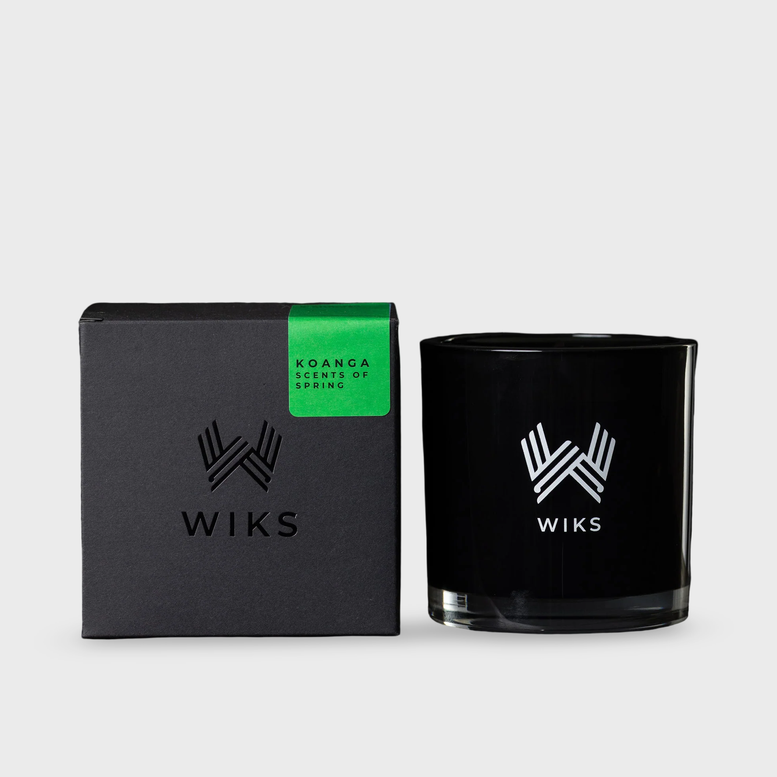 Black WIKS candle and packaging