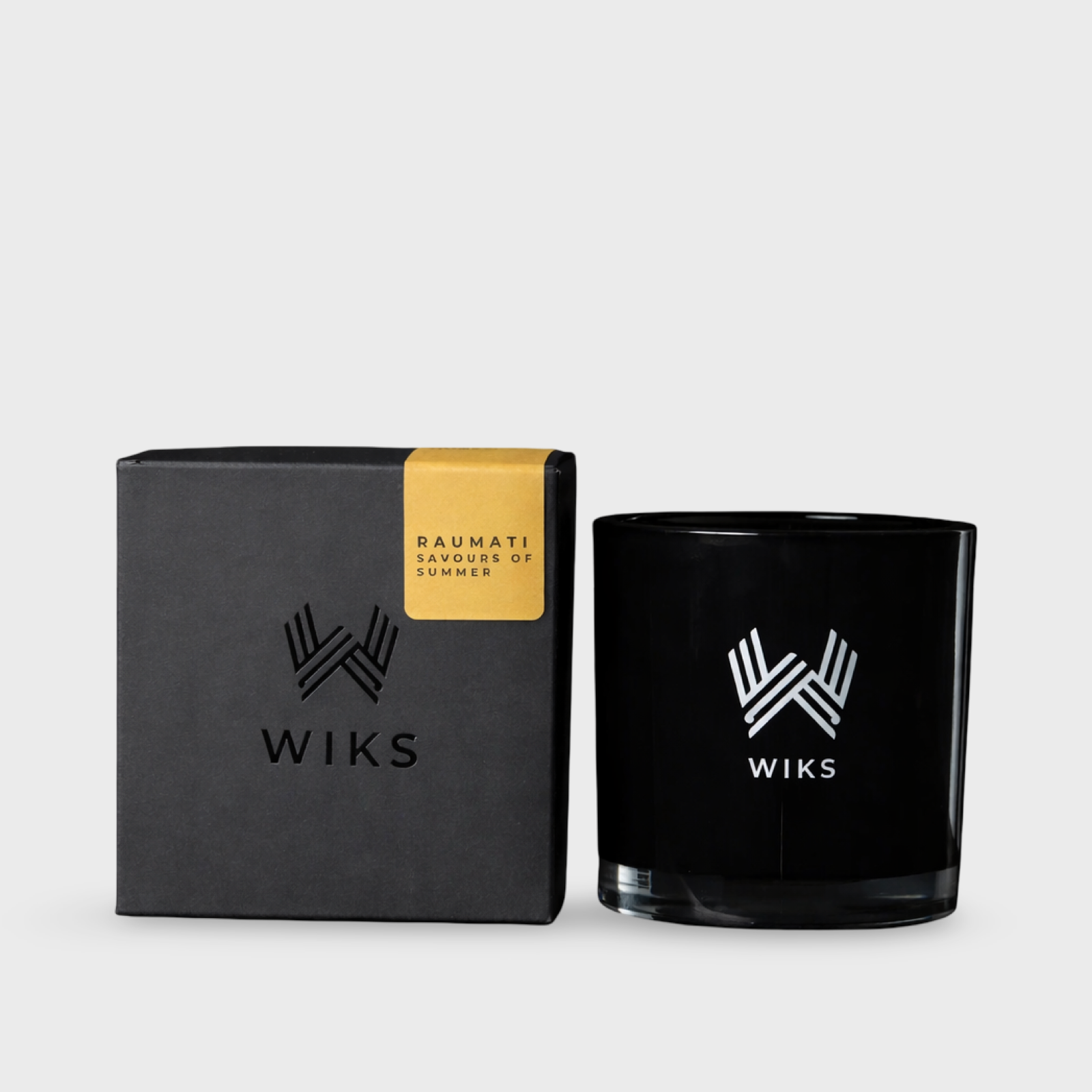 WIKS candle and packaging on a light gray background