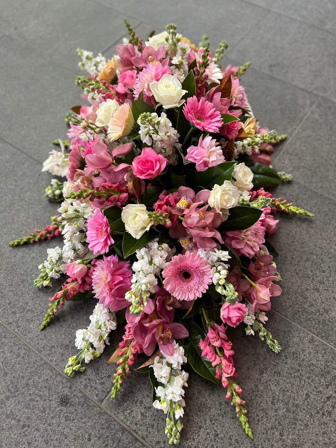 Juliette casket spray full arrangement – Auckland funeral flowers by Tomuri & Co.