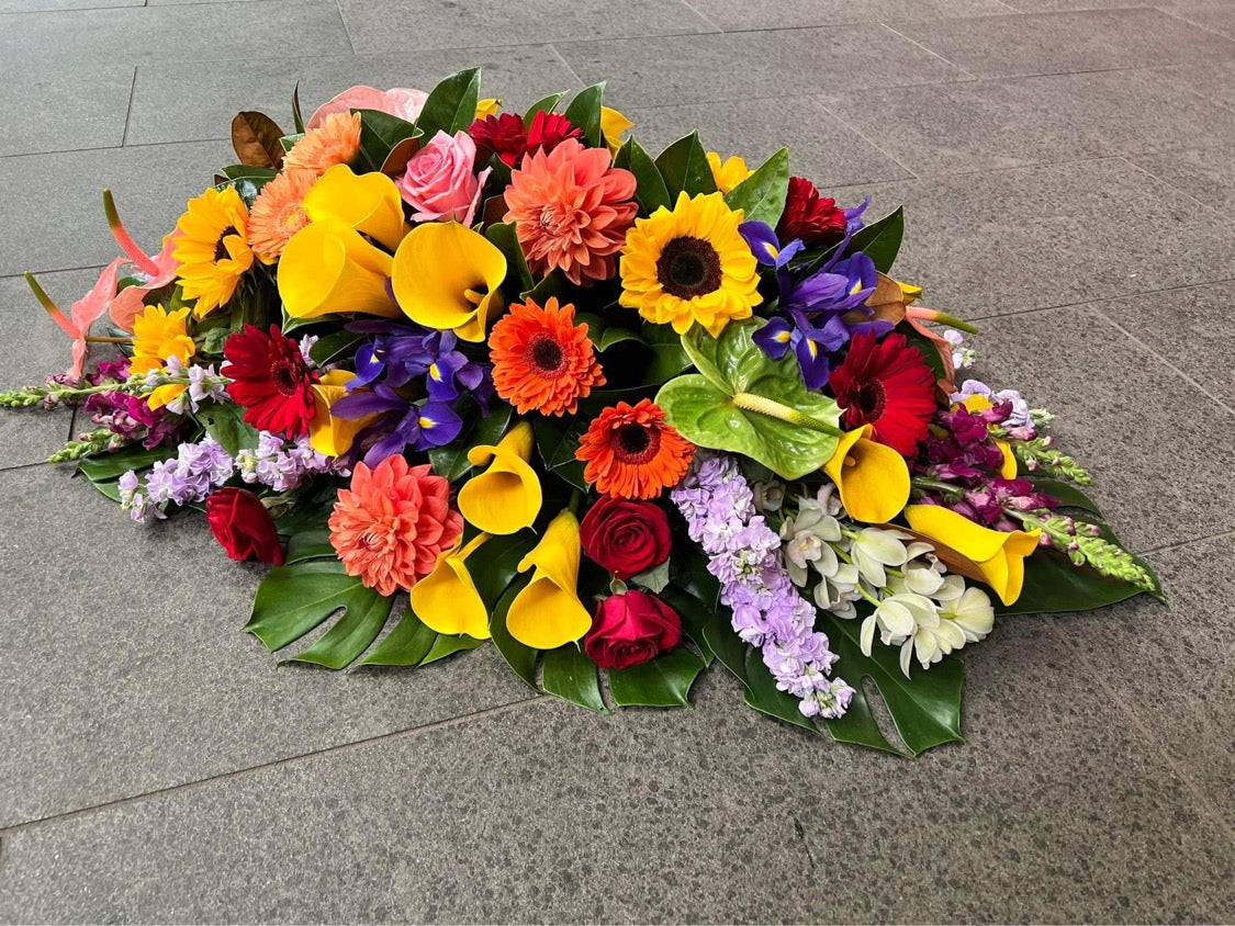 Livingstone casket spray – side angle – Auckland funeral flowers by Tomuri & Co.